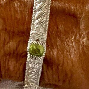 Judith Ripka oval silver bracelet with 3 peridot stones and 18 cz's